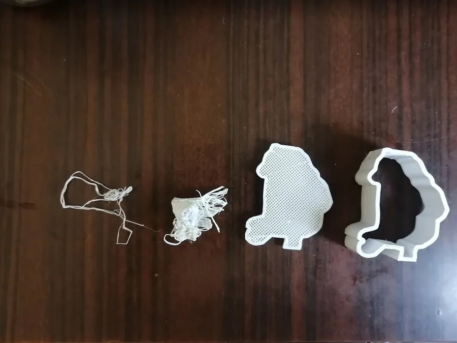 Failed and test 3D printed parts showing incomplete or unusable results